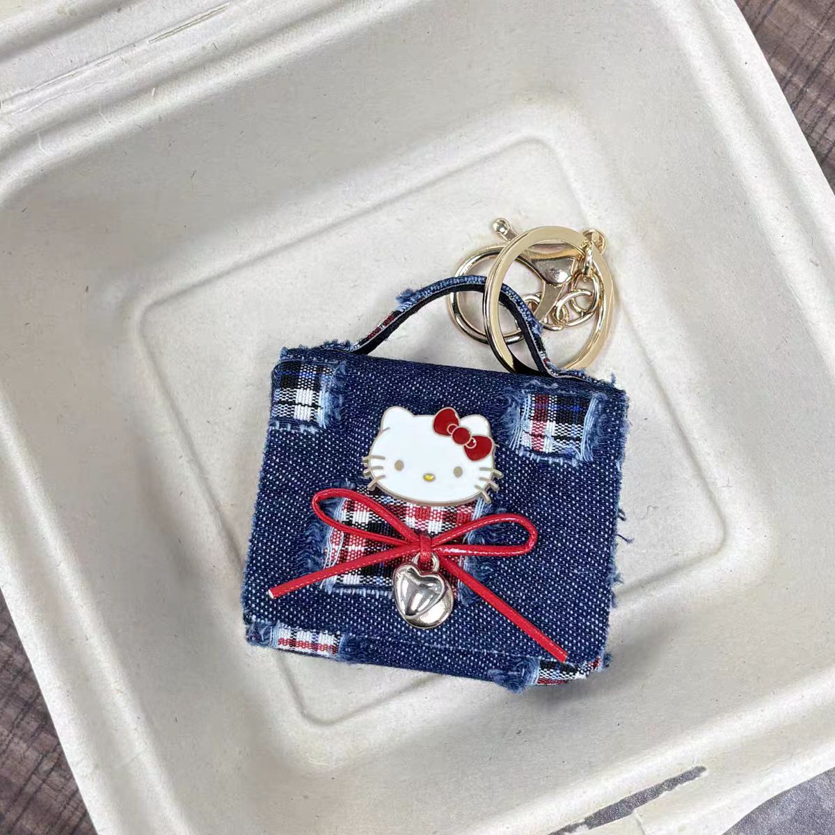 Hello Kitty AirPods Case Keychain – Denim Patchwork & Metallic Silver Protective Cover with Cute Bow & Bell Charm